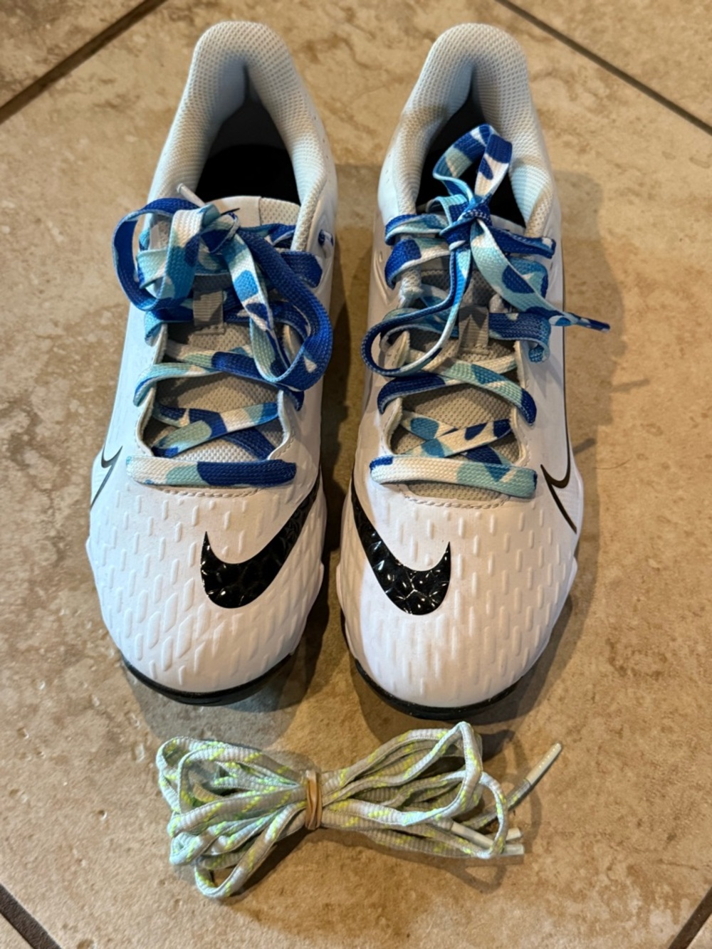 Nike White Athletic Shoes with Black Swoosh and Blue Accents